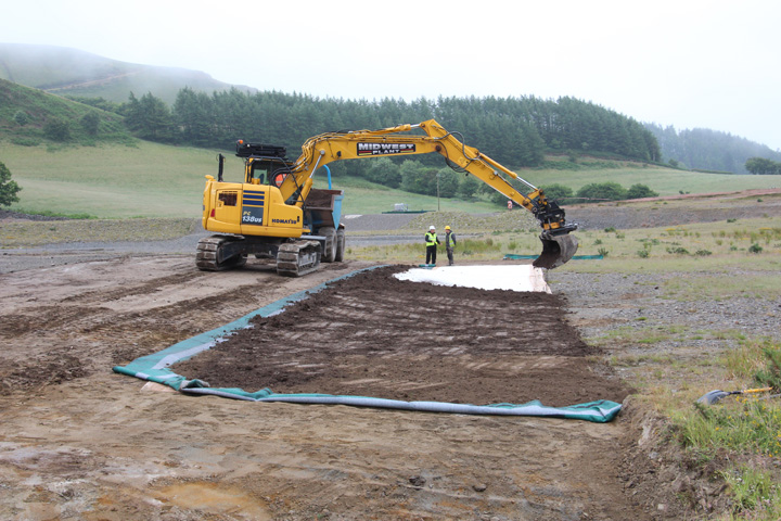 Laying soil on geosynthetic clay liner (GCL)